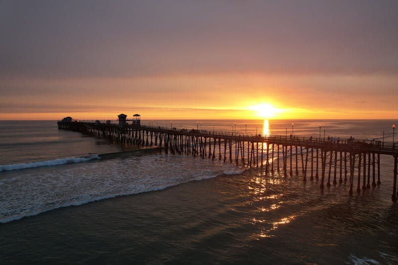 Golden sunset over the pier — a perfect end to a beach day